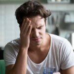 0_Young-man-suffering-from-headache-migraine-or-hangover-at-home.jpg