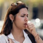 0_Young-woman-coughing-at-street.jpg