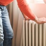 0_mature-adult-man-sits-and-warms-himself-by-the-radiator-in-the-room.jpg