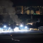 105199703-15431505-Smoke_rises_from_La_Carlota_Airport_in_Caracas_Venezuela_after_a-a-25_17674628511.avif