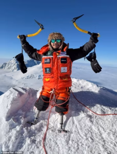 105389059-15450509-Hari_Budha_Magar_raises_his_ice_picks_in_victory_at_the_summit_o-m-26_17679928190.avif