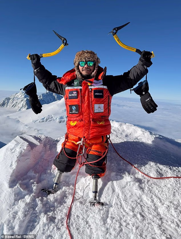 105389059-15450509-Hari_Budha_Magar_raises_his_ice_picks_in_victory_at_the_summit_o-m-26_17679928190.avif