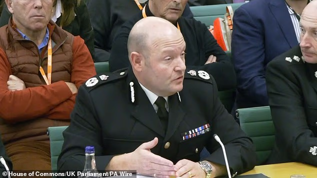 105498243-15463453-West_Midlands_Police_chief_constable_Craig_Guildford_at_Home_Aff-a-47_17684008932.avif
