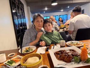 105880543-15503697-Austen_Keith_Richardson_pictured_with_his_grandmother_Yao_Fang-a-4_1769555399533.avif