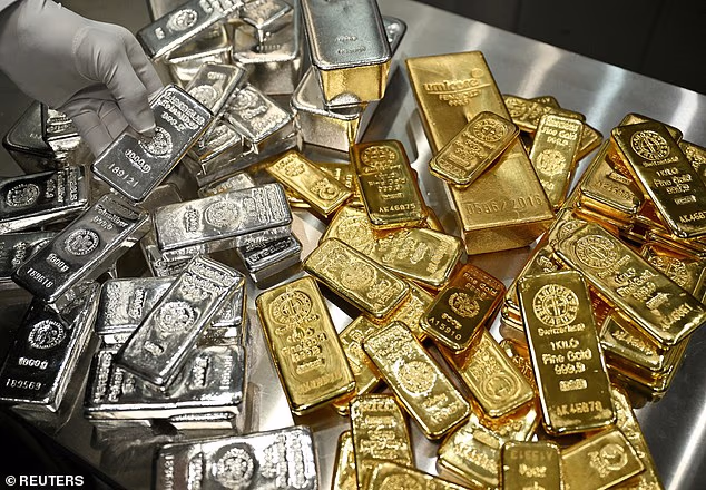 105929621-15509047-All_that_glitters_Precious_metal_prices_are_surging_as_investors-a-16_17696924124.avif