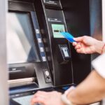1767422057_0_Woman-using-ATM-for-cash-withdrawal-with-credit-card.jpg
