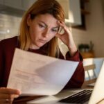 1769060051_0_Young-woman-going-over-her-finances-at-home-while-using-her-laptop.jpg