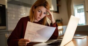 1769060051_0_Young-woman-going-over-her-finances-at-home-while-using-her-laptop.jpg