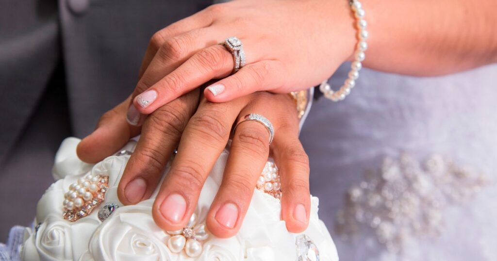 1_Just-married-couple-showing-rings.jpg