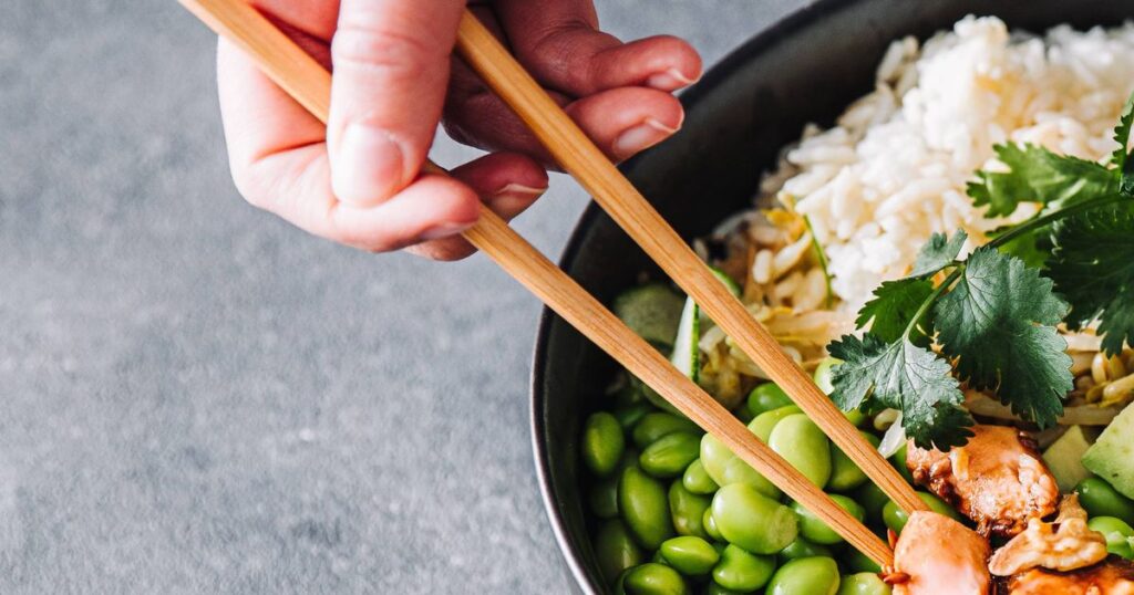 1_Woman-eating-poke-salad-with-chopsticks.jpg