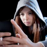 1_teenager-hacker-girl-using-mobile-phone-internet-cyber-crime-expert.jpg