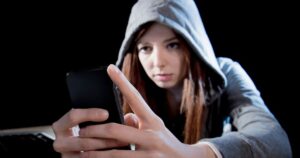 1_teenager-hacker-girl-using-mobile-phone-internet-cyber-crime-expert.jpg