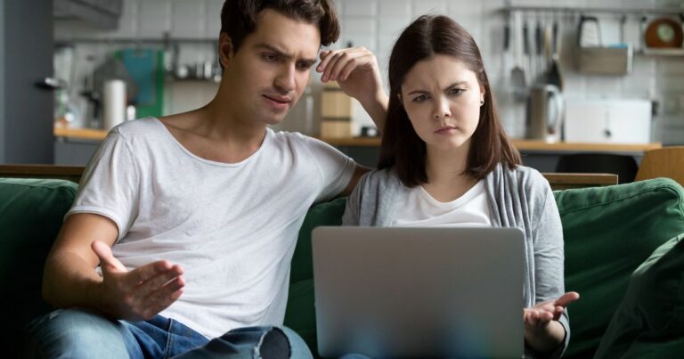 4_Millennial-couple-annoyed-by-stuck-laptop-confused-by-online-news.jpg