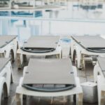 5_Empty-sunbeds-waiting-by-the-reflecting-water-of-a-swimming-pool-in-a-resort.jpg
