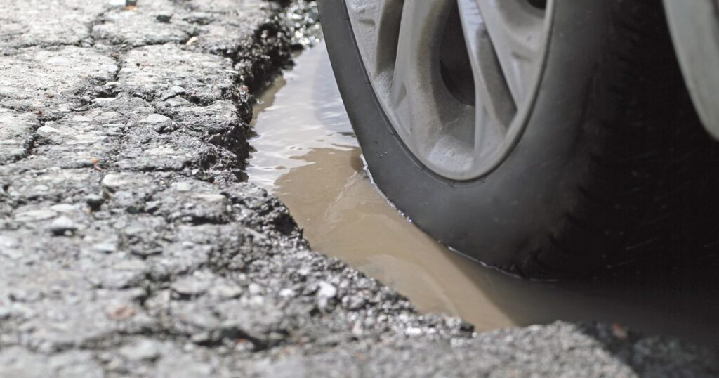 6_Alloy-Wheel-And-Tire-In-A-Pothole-Closeup.jpg