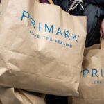 6_Shoppers-carrying-a-large-number-of-Primark-shopping-bags-on-a-train.jpg