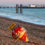 buoy-washed-beach-brighton-1049022375.jpg