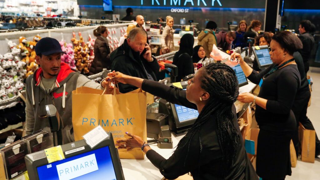 cashier-hands-shopping-customer-primark-908405106.jpg