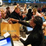 cashier-hands-shopping-customer-primark-908405106.jpg