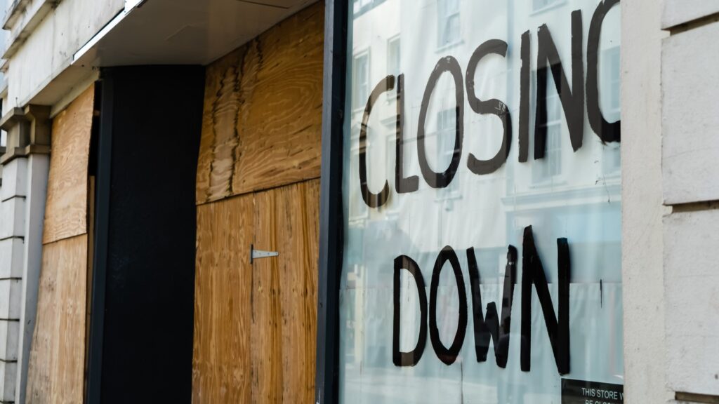 closing-sign-boarded-up-shop-1047225706.jpg