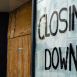 closing-sign-boarded-up-shop-1047225706.jpg