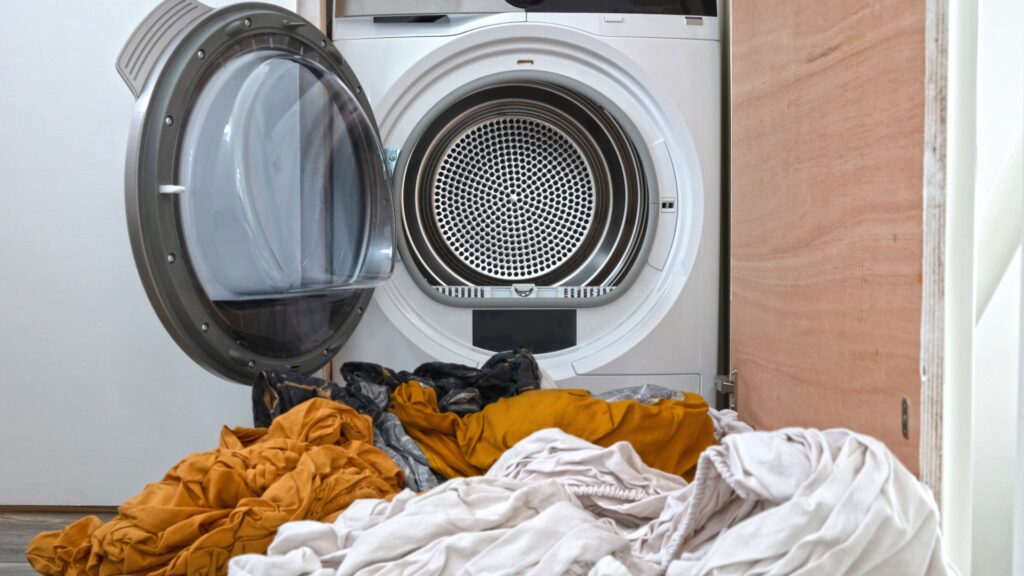 dirty-laundry-flowing-washing-machine-1051121853.jpg