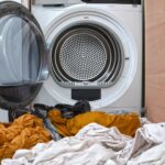 dirty-laundry-flowing-washing-machine-1051121853.jpg