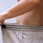 man-diet-comparing-waist-size-1049379773.jpg