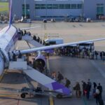 passengers-boarding-wizz-air-airplane-1037574823.jpg