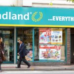 pedestrians-walk-poundland-store-reading-1042421379.jpg
