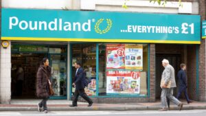 pedestrians-walk-poundland-store-reading-1042421379.jpg