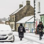 people-snowy-conditions-goathland-north-1050814448.jpg