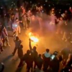skynews-iran-protests-protesters-dancing-round_7133035.jpg