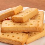0_A-closeup-photo-of-Scottish-shortbread-butter-cookies-on-a-rustic-wooden-background.jpg