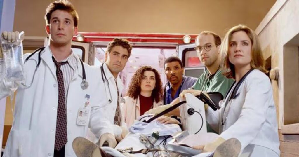 0_A-group-of-medical-professionals-stand-around-a-figure-on-a-bed.jpg