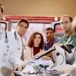 0_A-group-of-medical-professionals-stand-around-a-figure-on-a-bed.jpg