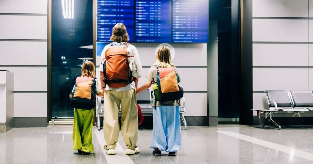 0_Family-checking-flights-on-departure-board-at-airport.jpg