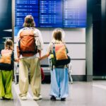 0_Family-checking-flights-on-departure-board-at-airport.jpg