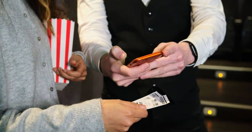 0_Usher-scanning-movie-tickets-at-cinema-with-smartphone.jpg
