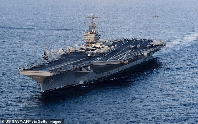106296843-15557803-The_USS_Abraham_Lincoln_along_with_a_strike_group_is_currently_s-a-9_177099482273.avif