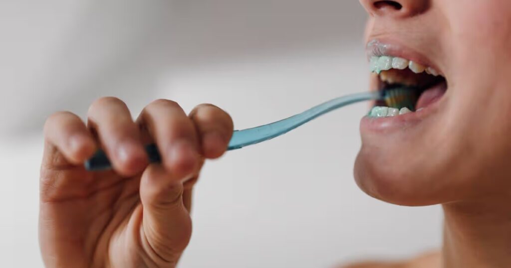 2_Healthy-smile-person-brushing-their-teeth-up-close.jpg