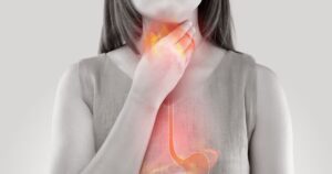 2_Woman-Suffering-From-Acid-Reflux-Or-Heartburn-Isolated-On-White-Background.jpg