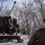 Ukrainian-servicemen-prepare-a-Bohdana-self-propelled-howitzer-for-firing-towards-Russian-troops-nea.avif