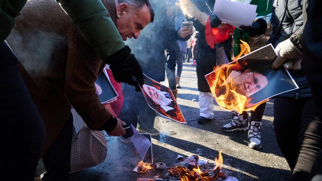 protesters-burn-pictures-iranian-supreme-1055855272.webp.jpeg