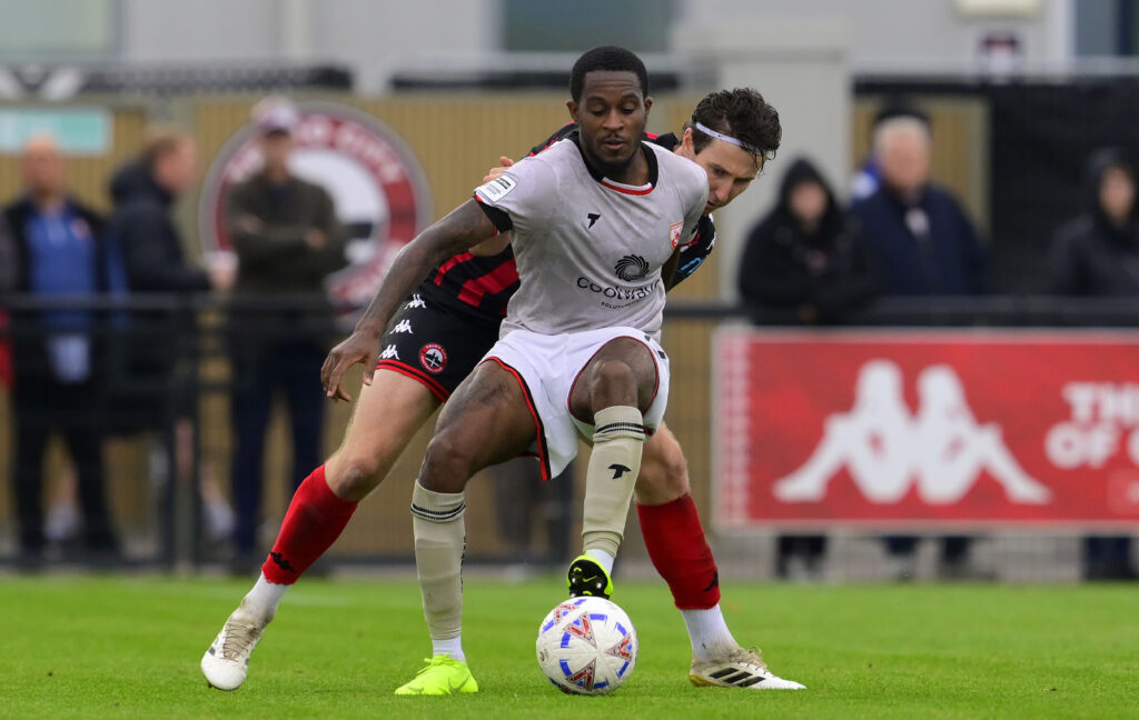 rolando-aarons-morecambe-challenges-ball-1057690113.jpg