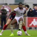 rolando-aarons-morecambe-challenges-ball-1057690113.jpg