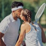 tennis-court-love-couple-kiss-1055040304.jpg